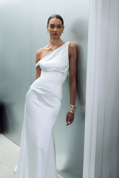 Asymmetric neckline wedding dress, styled with an elegant waspie corset