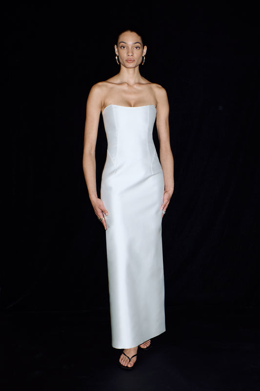 A minimalist, ankle length, column bridal gown