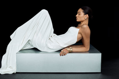 Flowing, corseted wedding dress with sculpted details and slim straps