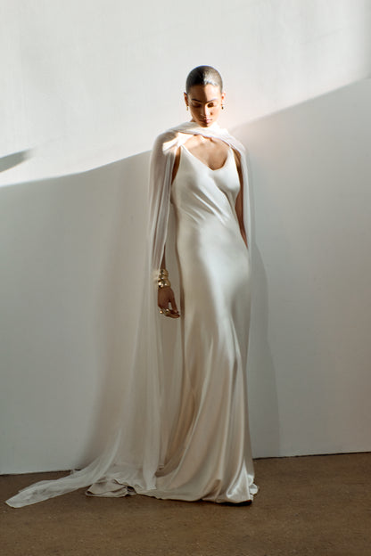 Elegant silk chiffon scarf cape, styled over a flowing slip gown